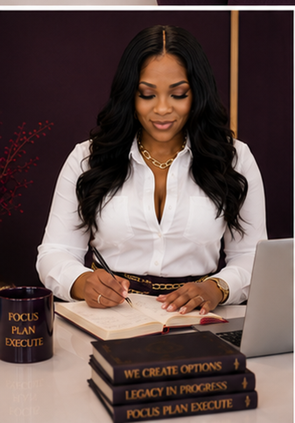 Chandra Florence writing in a notebook at a desk in The Option Era studio